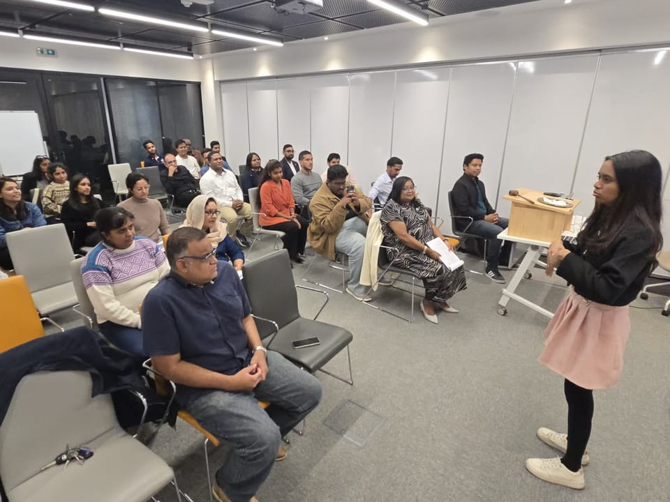 A member holds the room mid-speech at a typical meeting